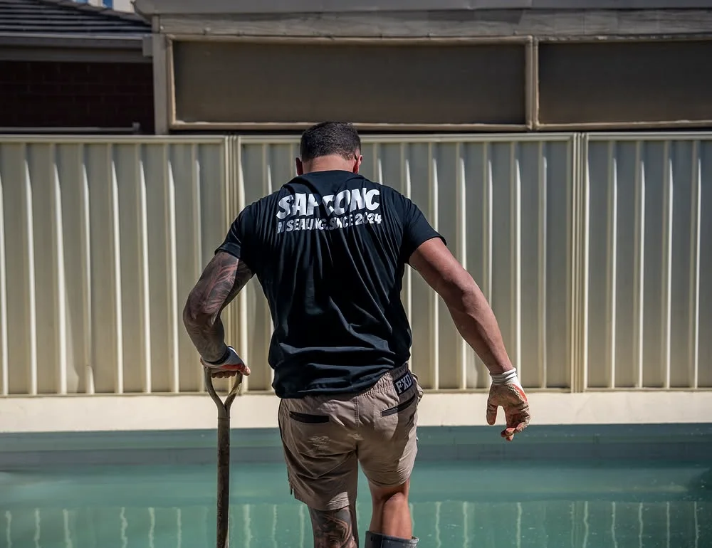 SAP team member preparing the Burton pool surround