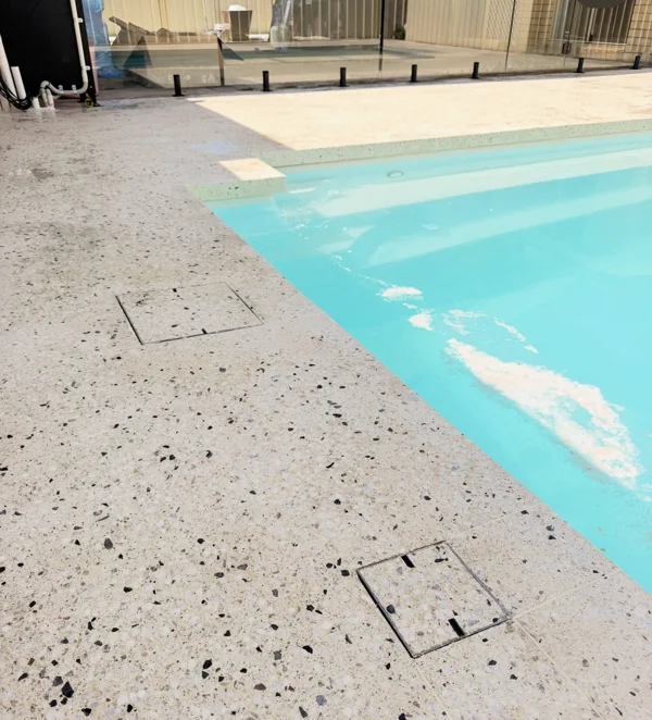 Finished concrete surface and detailed pool edges at Burton