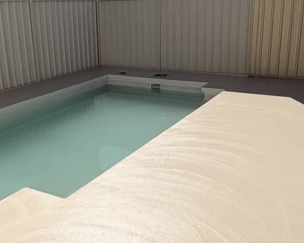 After: newly poured concrete around the same Burton pool, before honing